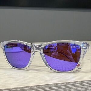 Oakley Transparent Frame Sunglasses with Blue Lenses